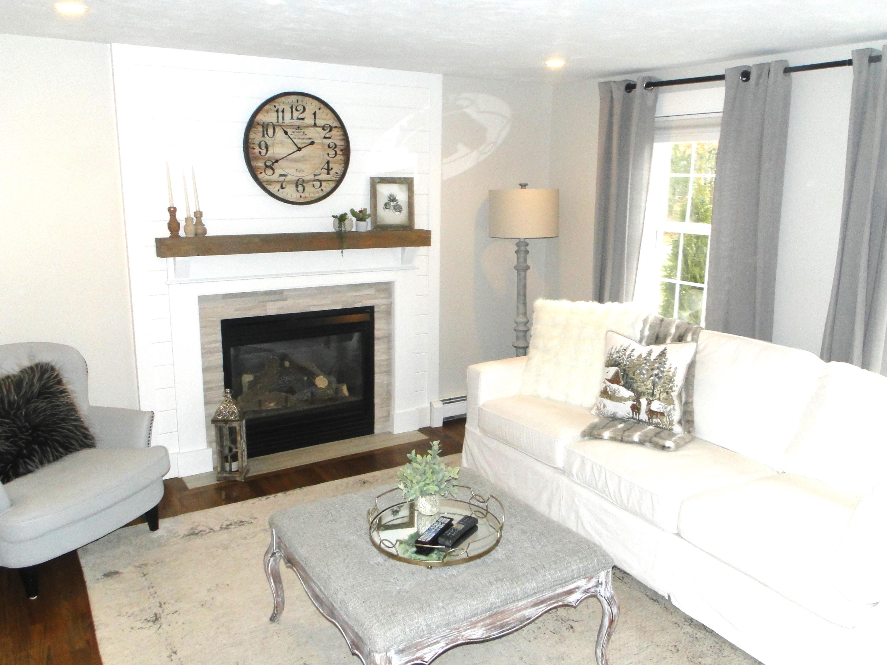30 Brewster Road Mashpee, MA 02649 - Photo 16 of 58 a living room with furniture a fireplace and a window