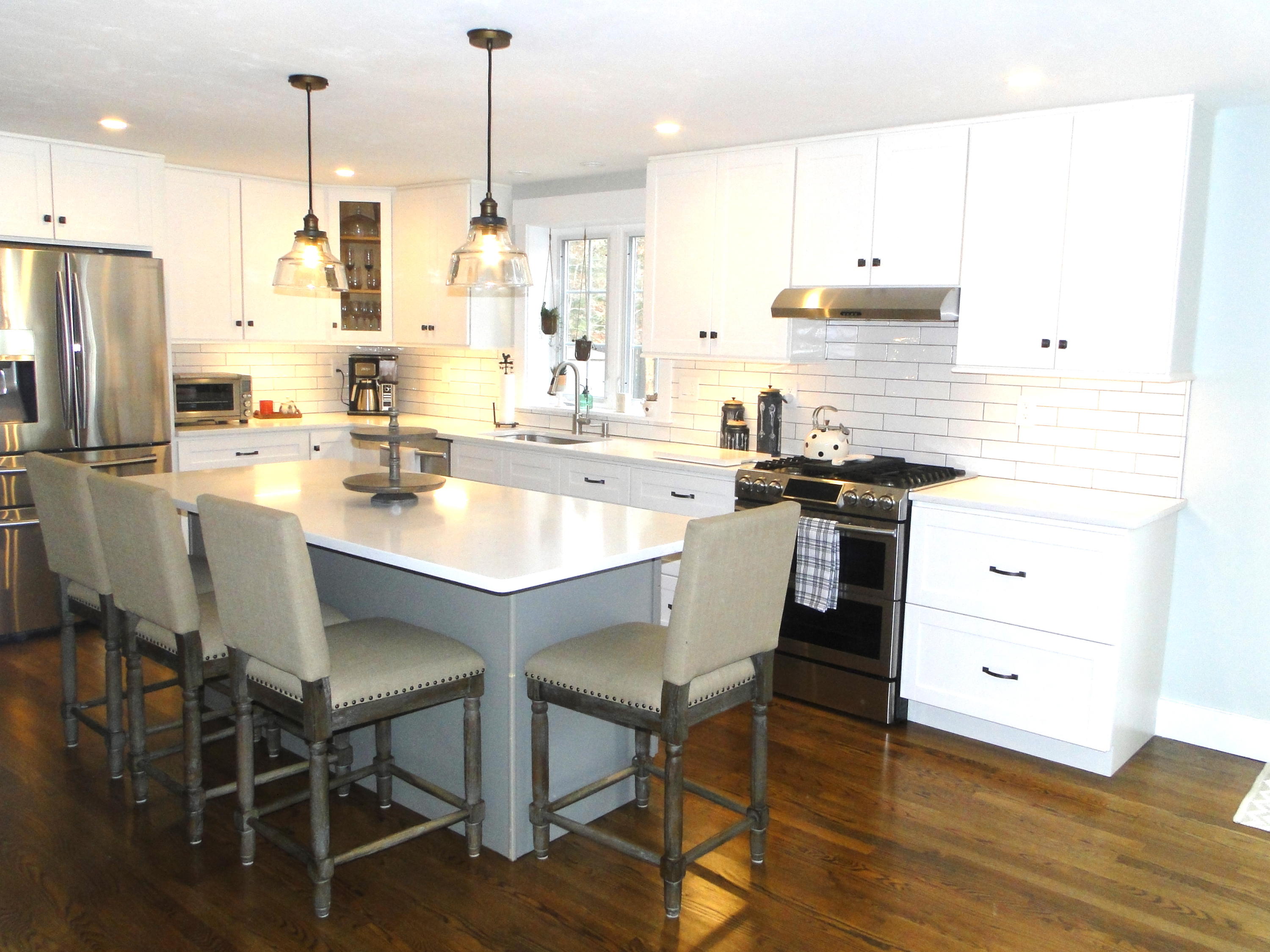 30 Brewster Road Mashpee, MA 02649 - Photo 2 of 58 a kitchen with stainless steel appliances and wooden floors