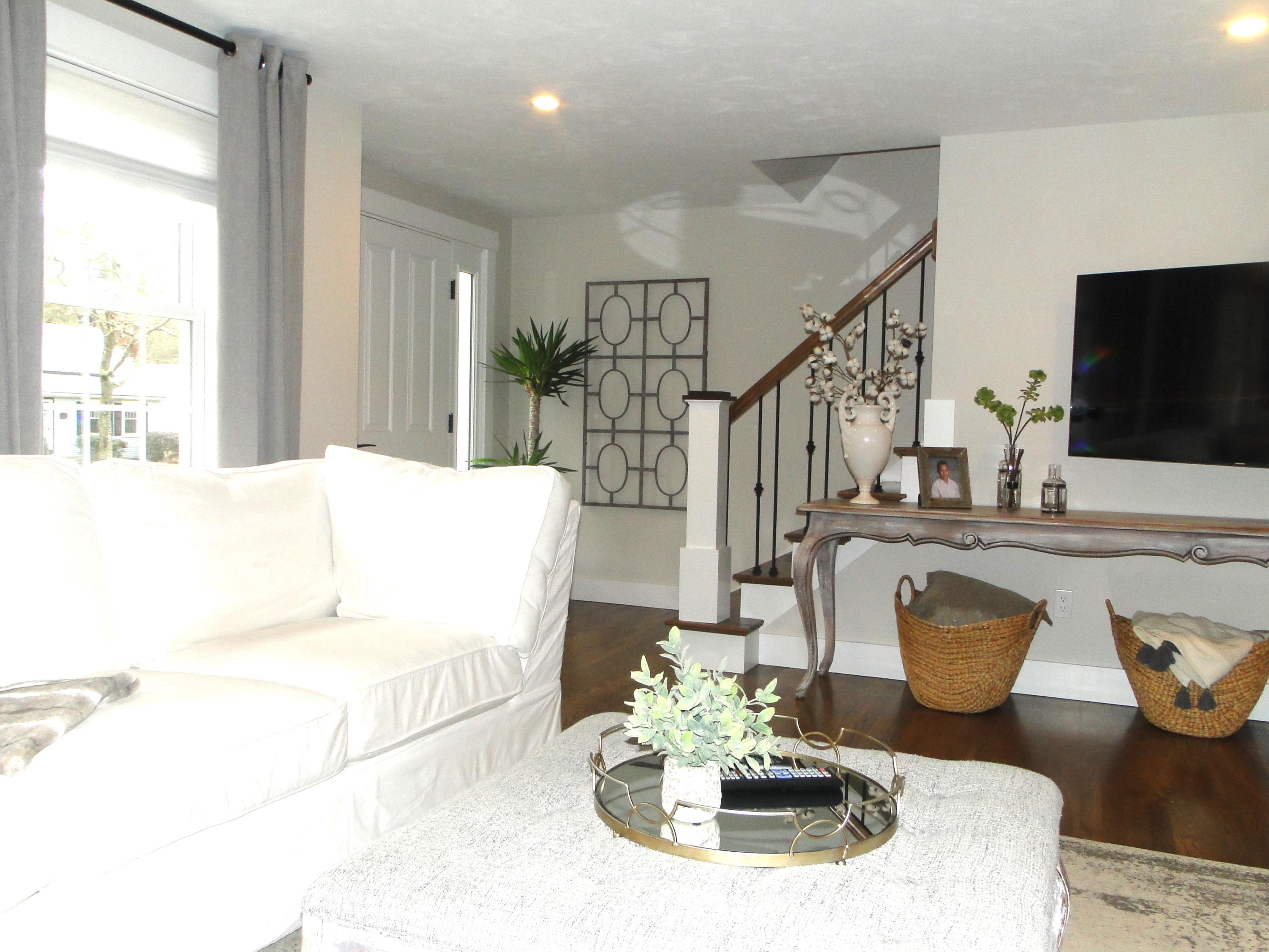 30 Brewster Road Mashpee, MA 02649 - Photo 24 of 58 a living room with furniture and a flat screen tv