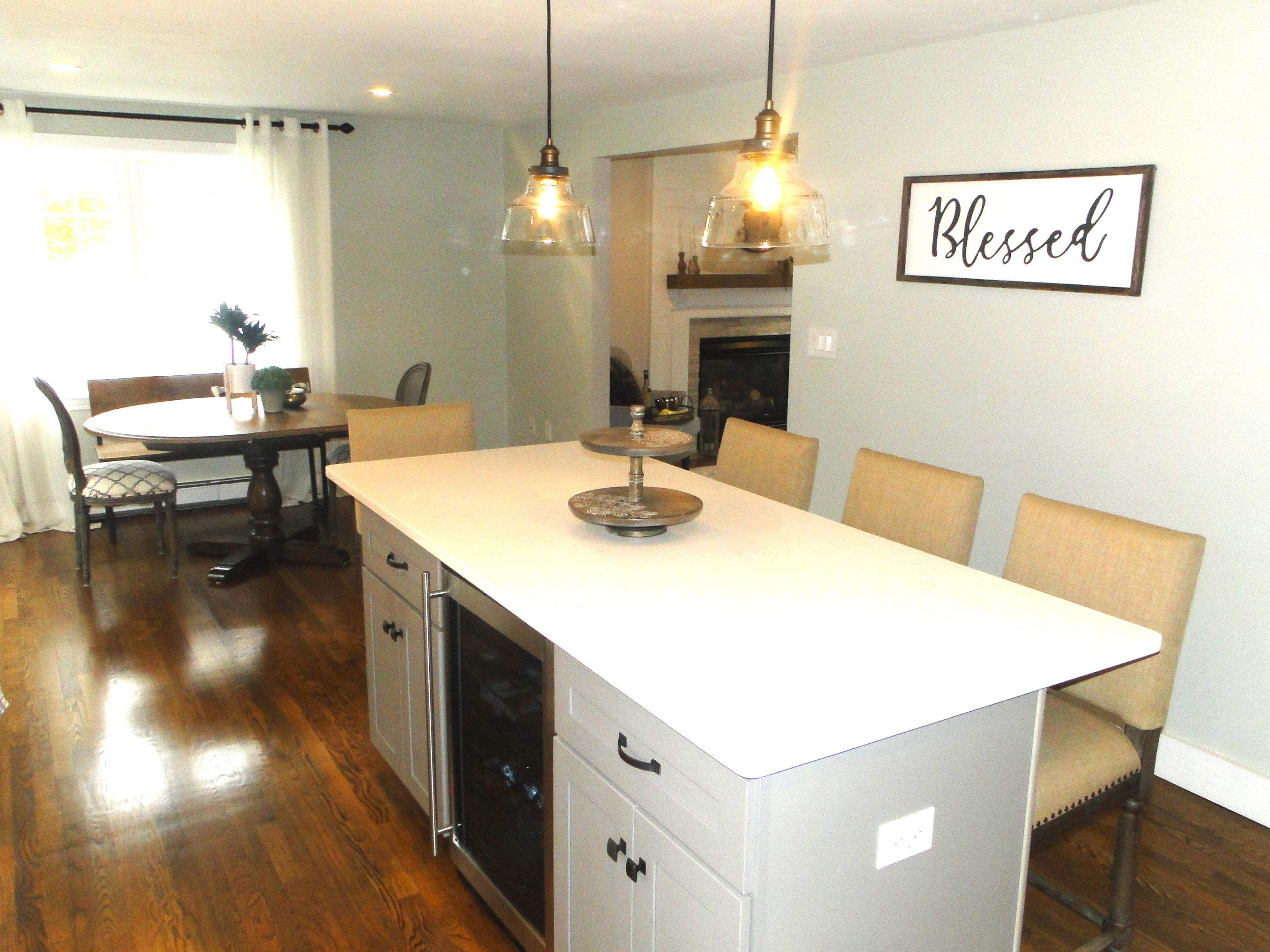 30 Brewster Road Mashpee, MA 02649 - Photo 3 of 58 a kitchen with a table chairs and a wooden floor