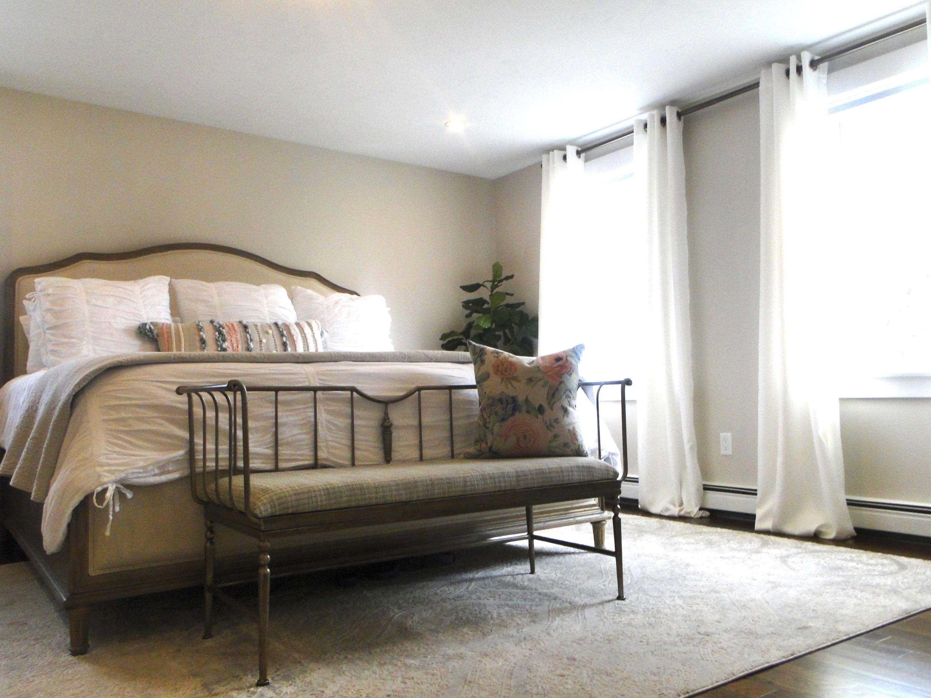 30 Brewster Road Mashpee, MA 02649 - Photo 32 of 58 a bedroom with a bed and a mirror