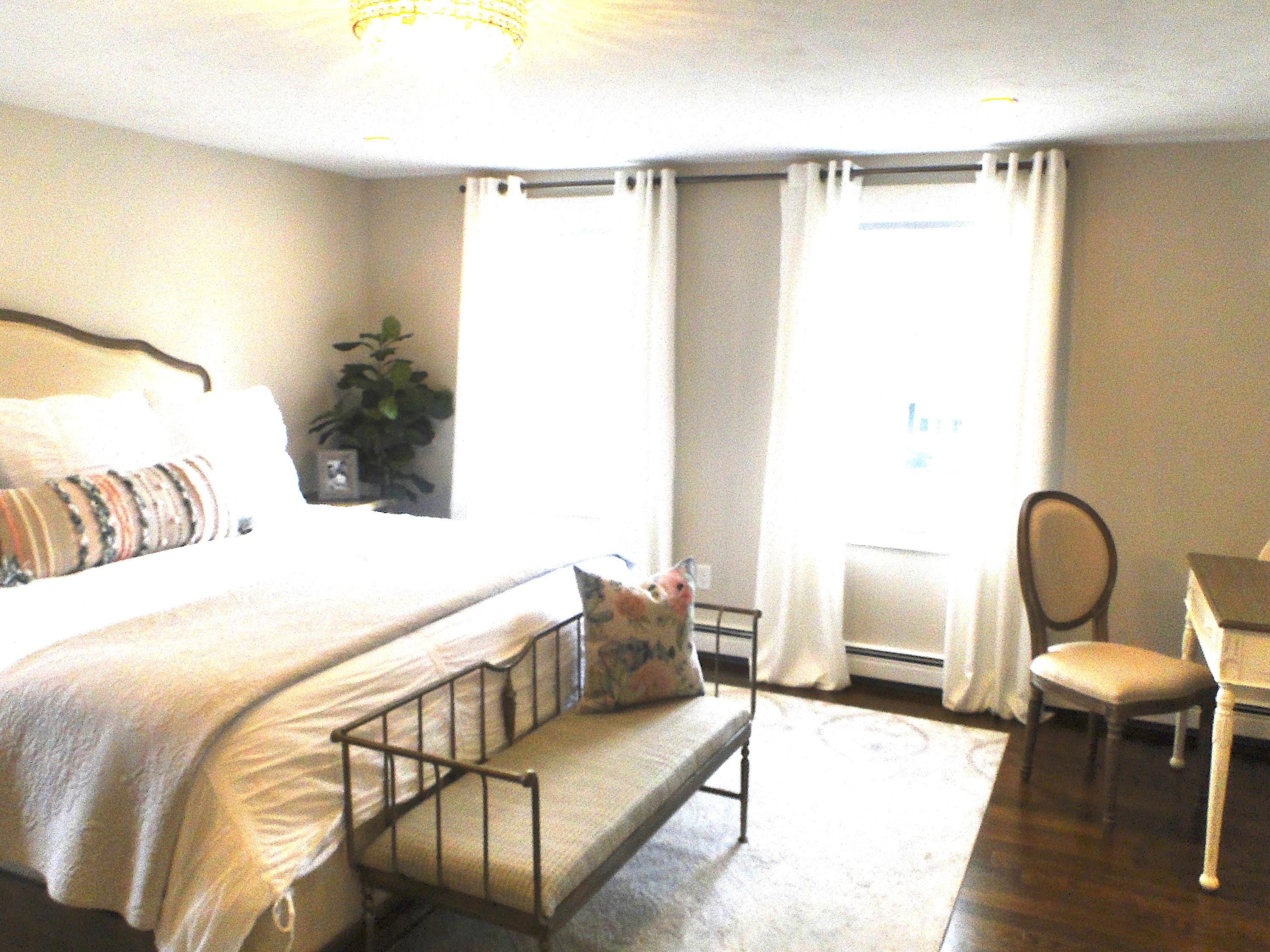 30 Brewster Road Mashpee, MA 02649 - Photo 34 of 58 a bedroom with a bed chair and a potted plant