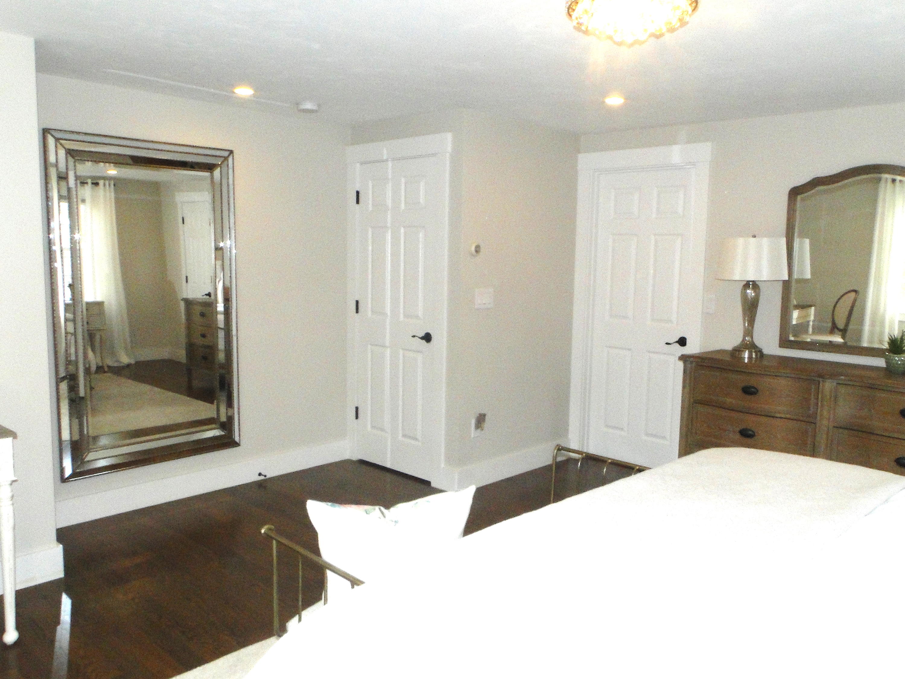 30 Brewster Road Mashpee, MA 02649 - Photo 35 of 58 a bedroom with a bed and a dresser