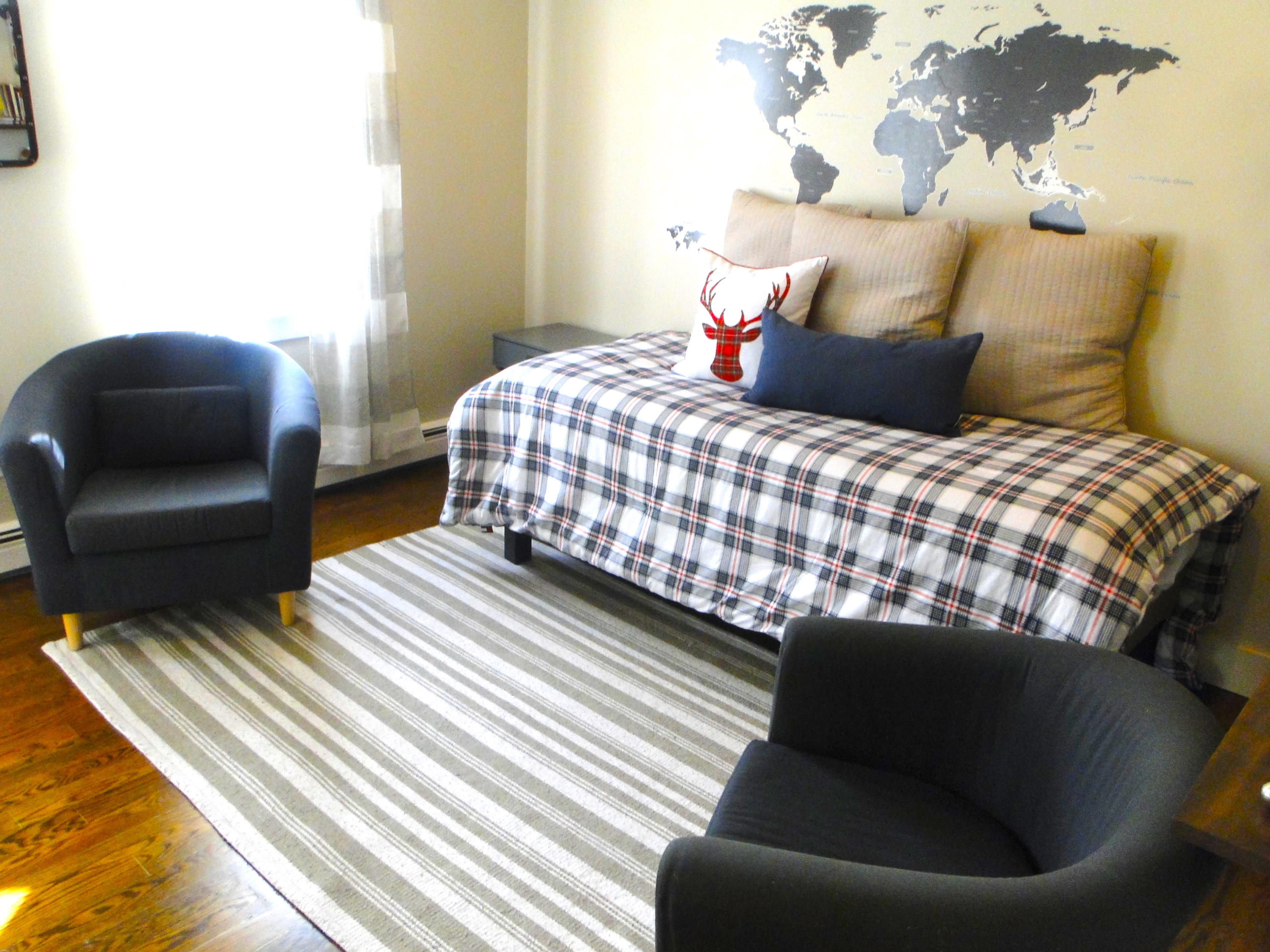 30 Brewster Road Mashpee, MA 02649 - Photo 40 of 58 a bedroom with a bed and a chair