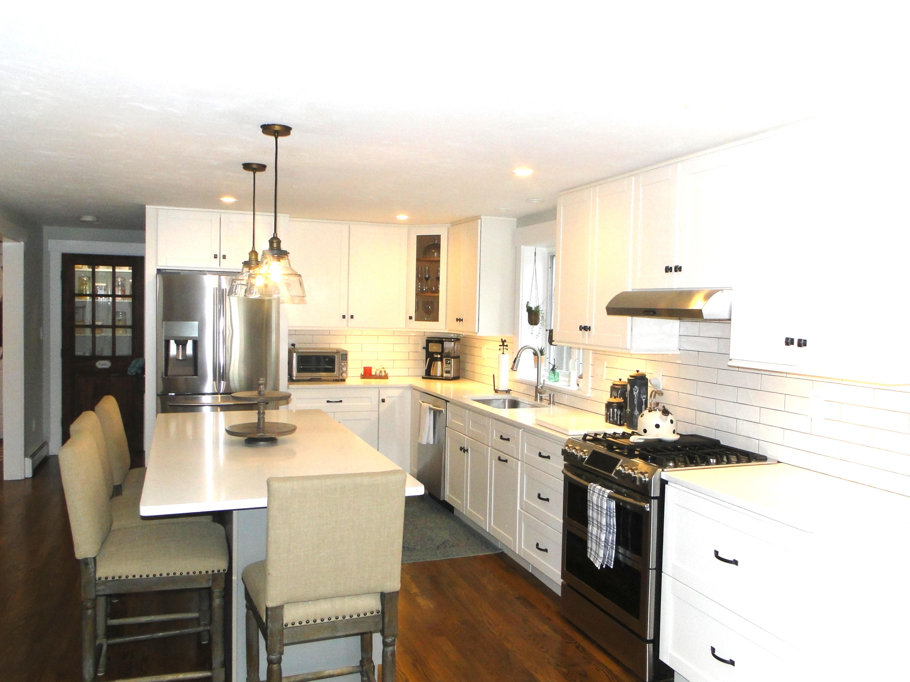 30 Brewster Road Mashpee, MA 02649 - Photo 5 of 58 a kitchen with stainless steel appliances kitchen island granite countertop a sink stove and cabinets
