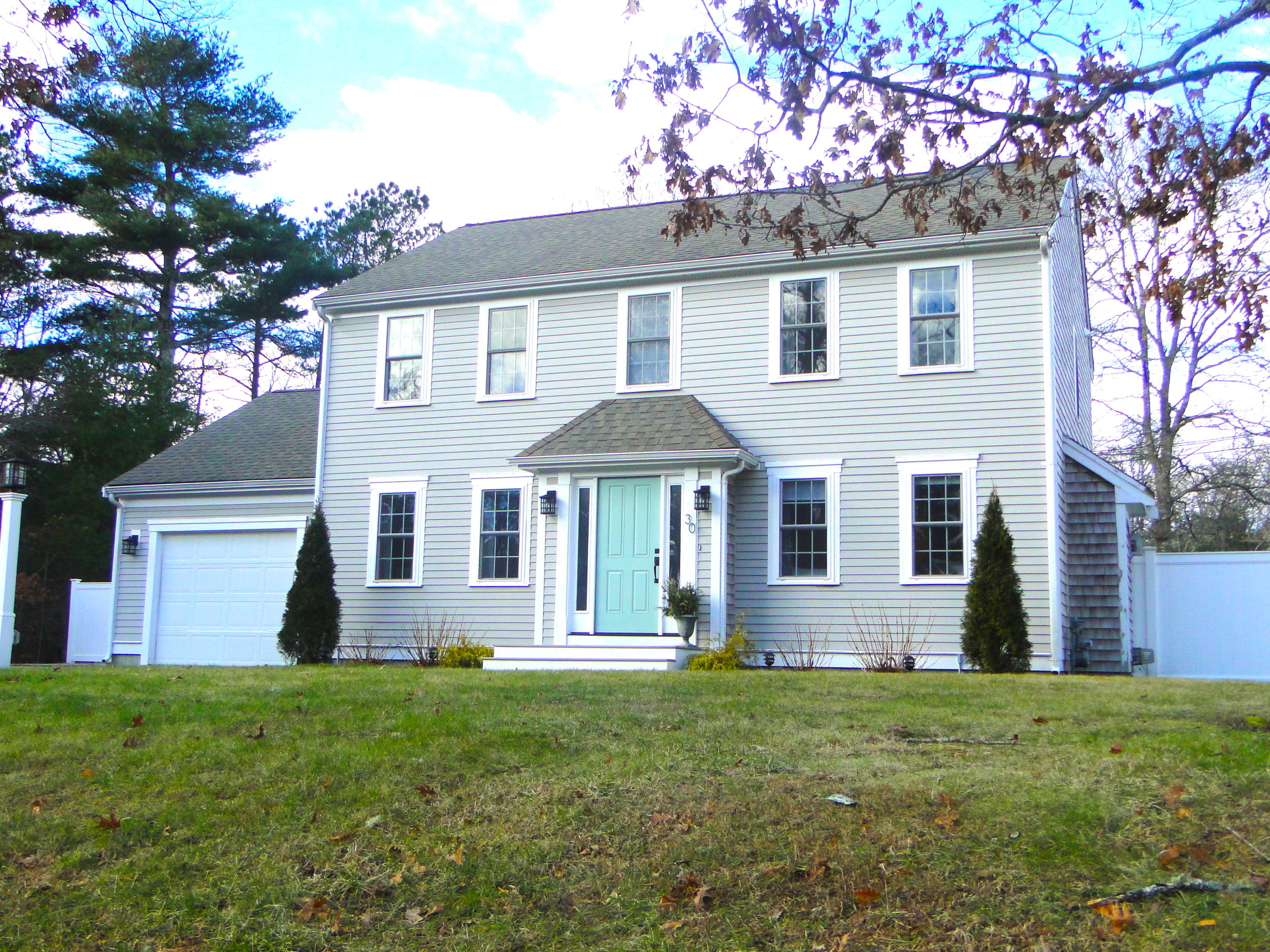 30 Brewster Road Mashpee, MA 02649 - Photo 54 of 58 a front view of a house with a garden