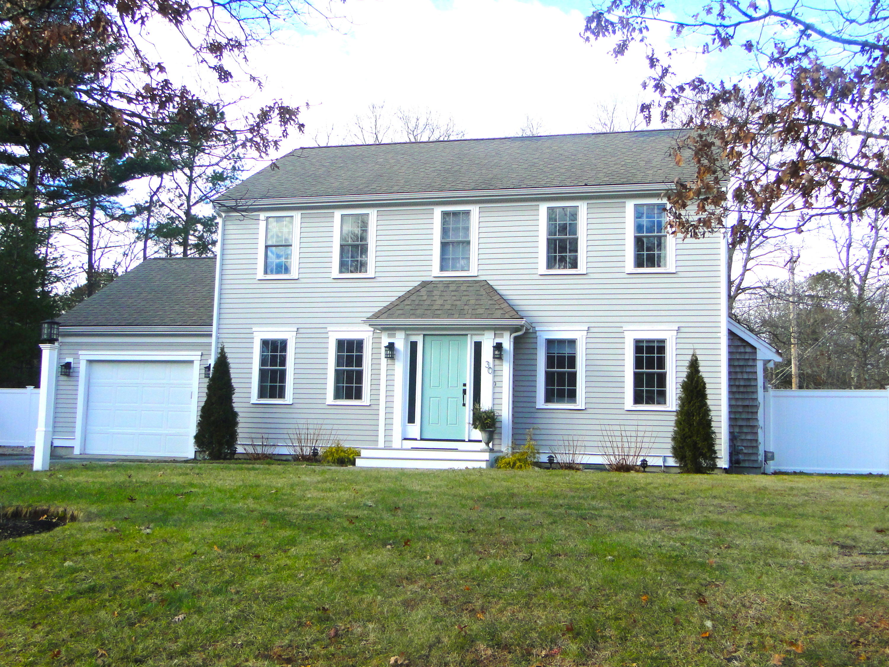 30 Brewster Road Mashpee, MA 02649 - Photo 56 of 58 a front view of house with yard and barbeque oven