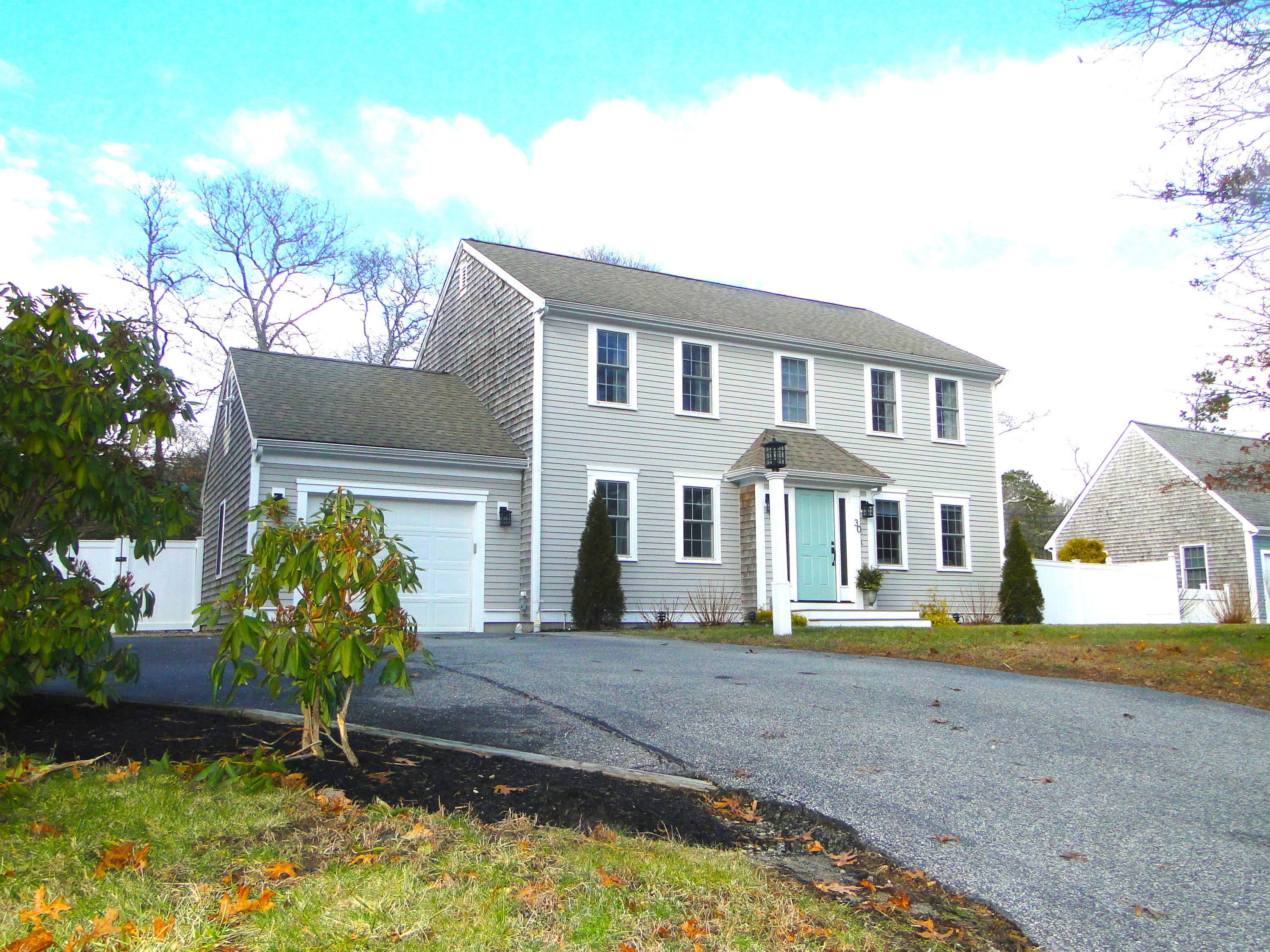30 Brewster Road Mashpee, MA 02649 - Photo 57 of 58 a front view of a house with garden