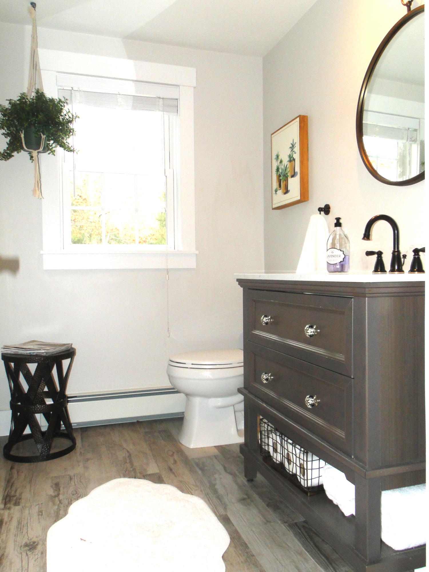 30 Brewster Road Mashpee, MA 02649 - Photo 8 of 58 a bathroom with a toilet sink and mirror