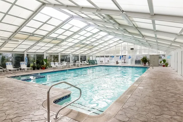 a view of a swimming pool with a patio