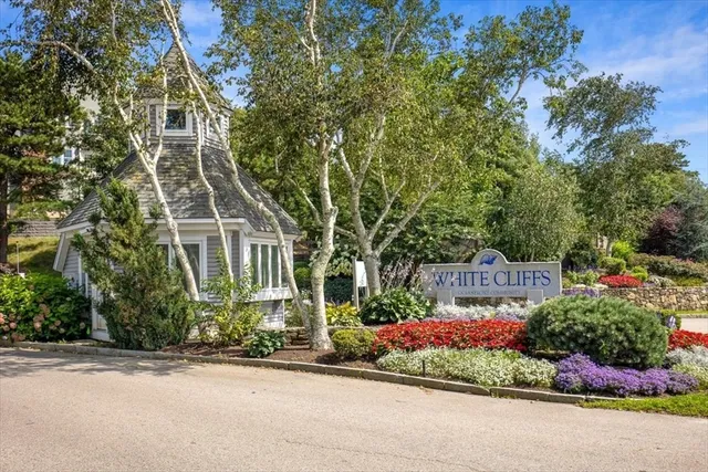 front view of a house next to a yard