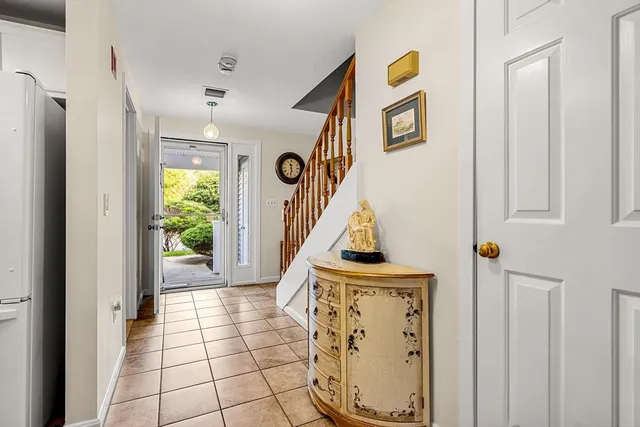 a view of an entryway with wooden floor