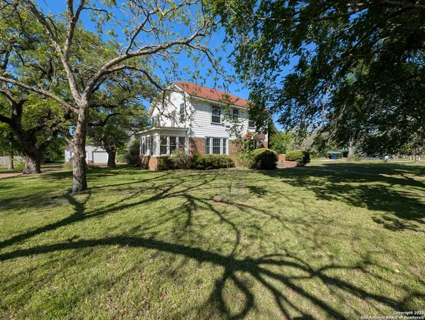 a view of a house with a big yard