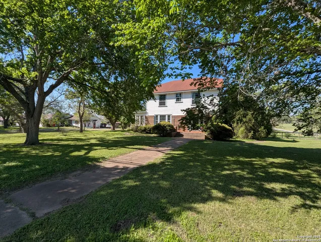 a view of a house with a big yard