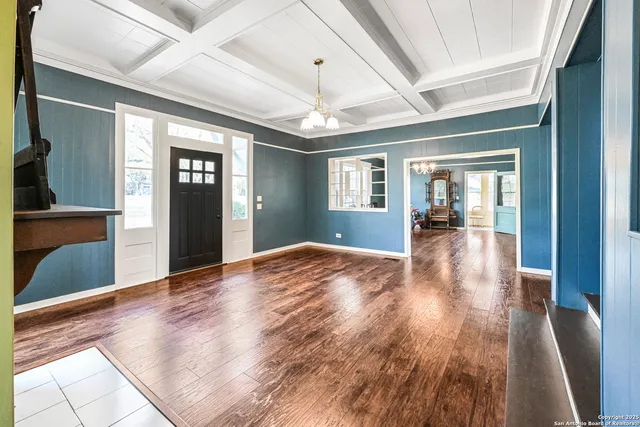 a view of livingroom with kitchen and hardwood floor