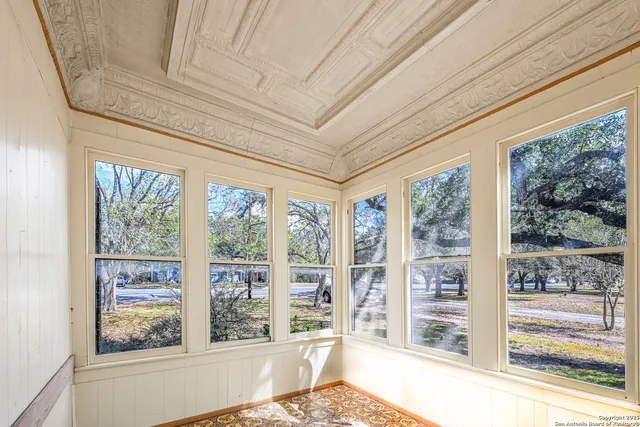 a living room with large windows