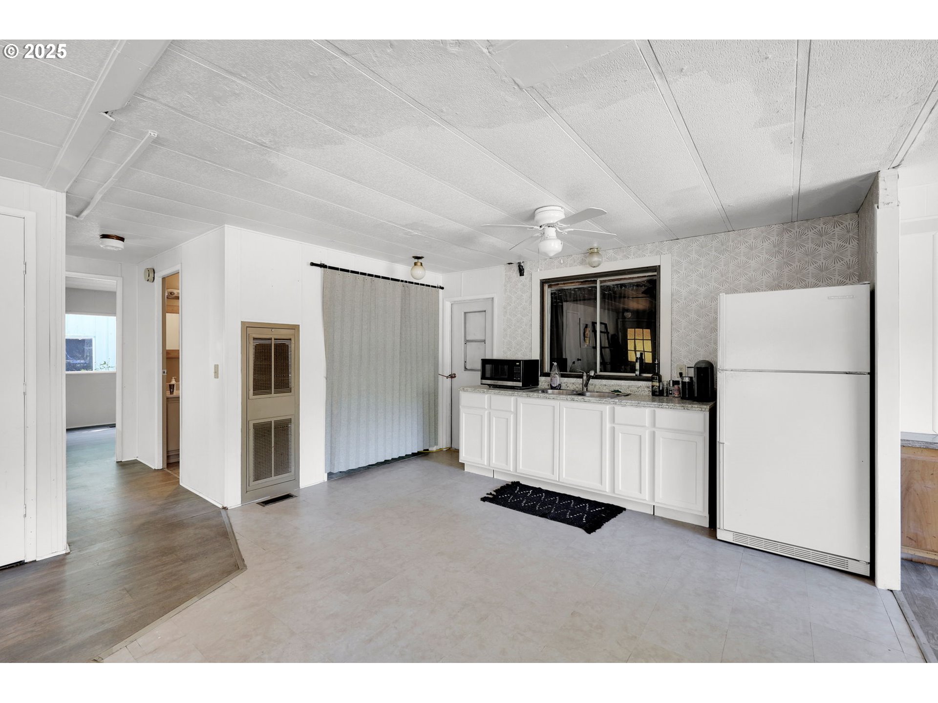 31145 Kenady Lane Cottage Grove, OR 97424 - Photo 13 of 47 a living room with furniture and a flat screen tv