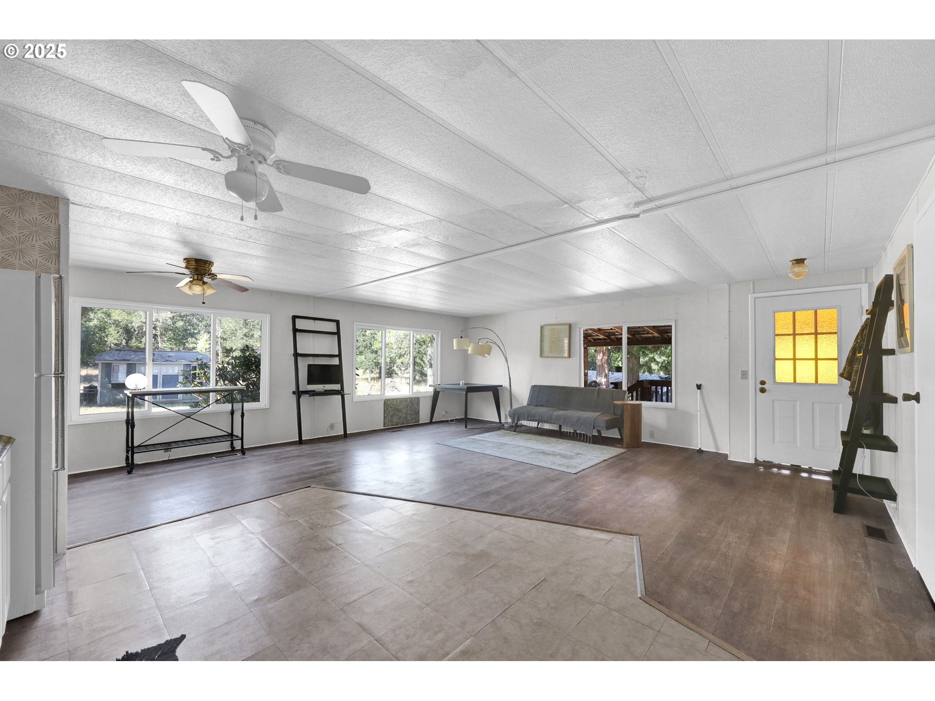31145 Kenady Lane Cottage Grove, OR 97424 - Photo 15 of 47 a view of a livingroom with furniture wooden floor and windows