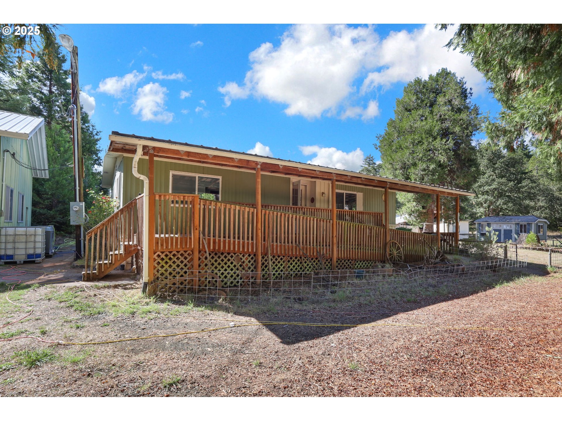 31145 Kenady Lane Cottage Grove, OR 97424 - Photo 2 of 47 a backyard of a house with a bench