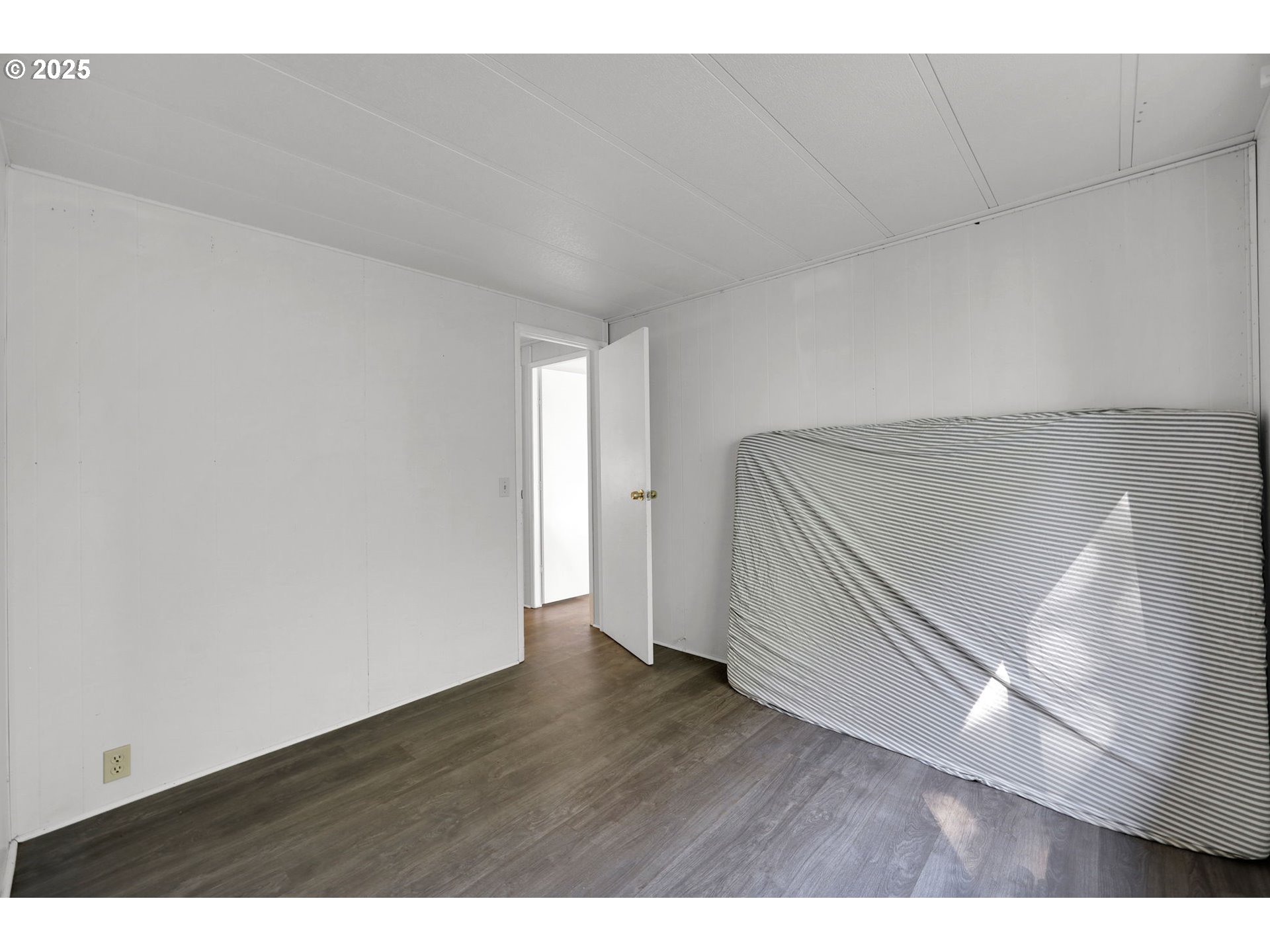 31145 Kenady Lane Cottage Grove, OR 97424 - Photo 21 of 47 a view of an empty room and wooden floor