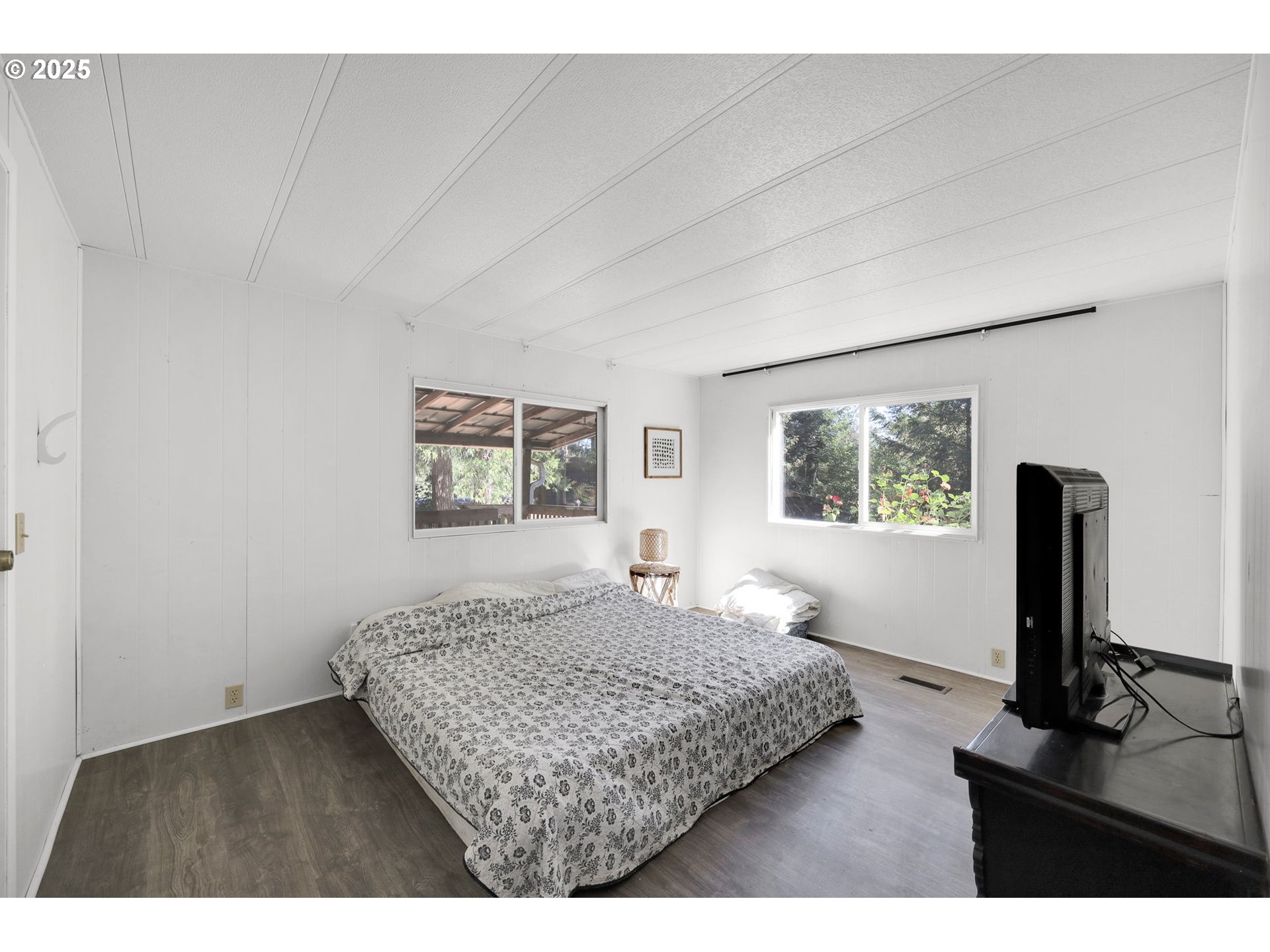 31145 Kenady Lane Cottage Grove, OR 97424 - Photo 22 of 47 a bedroom with a bed window and flat screen tv