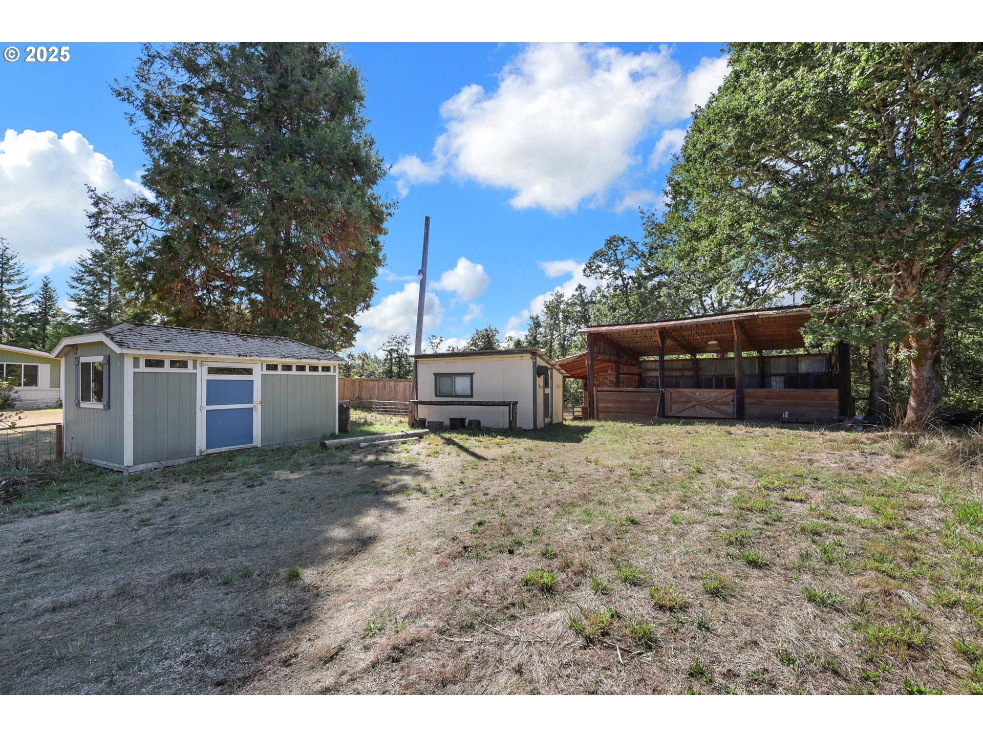 31145 Kenady Lane Cottage Grove, OR 97424 - Photo 25 of 47 a view of a house with a yard