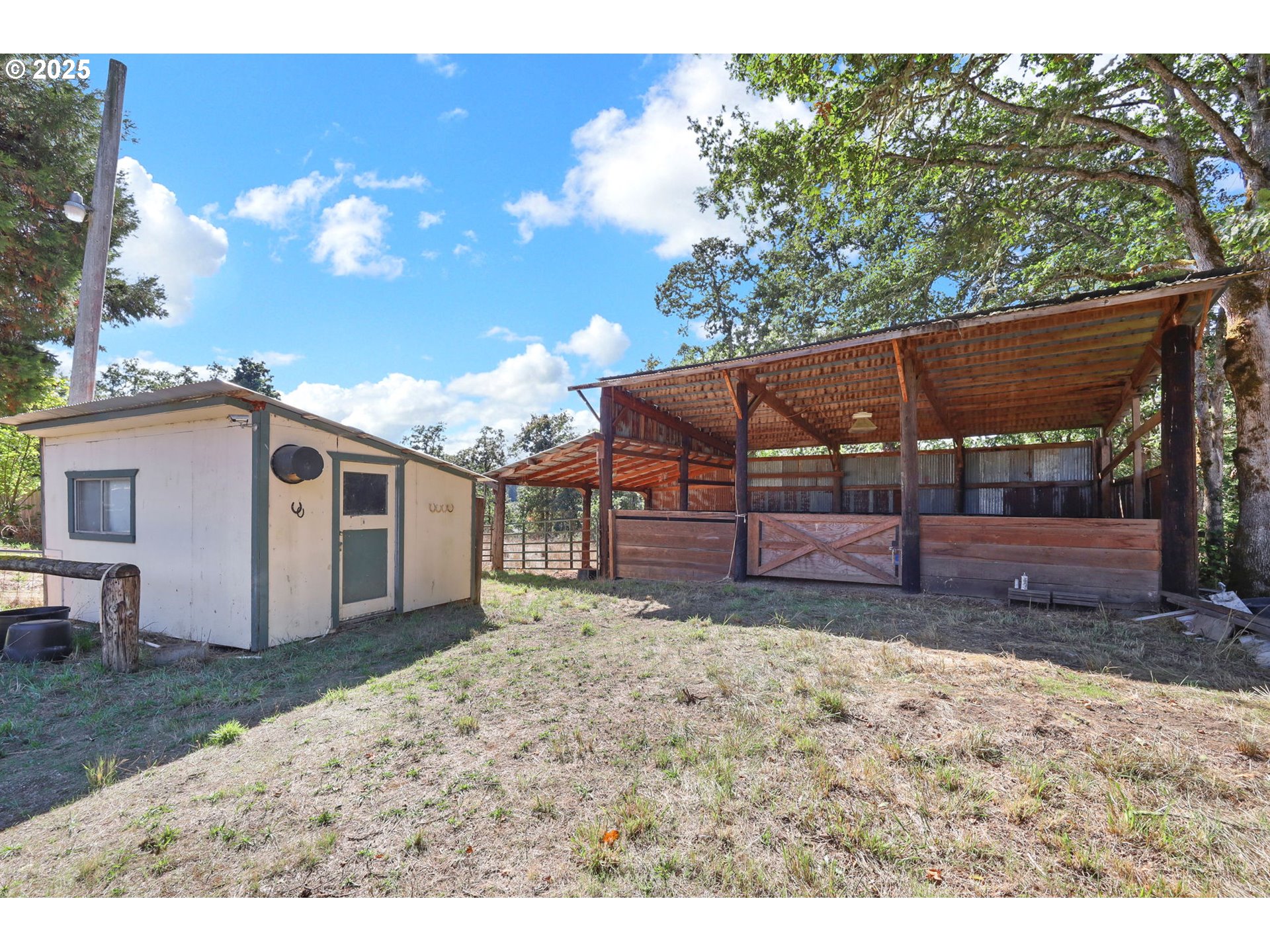 31145 Kenady Lane Cottage Grove, OR 97424 - Photo 26 of 47 a view of a grey house with a small yard