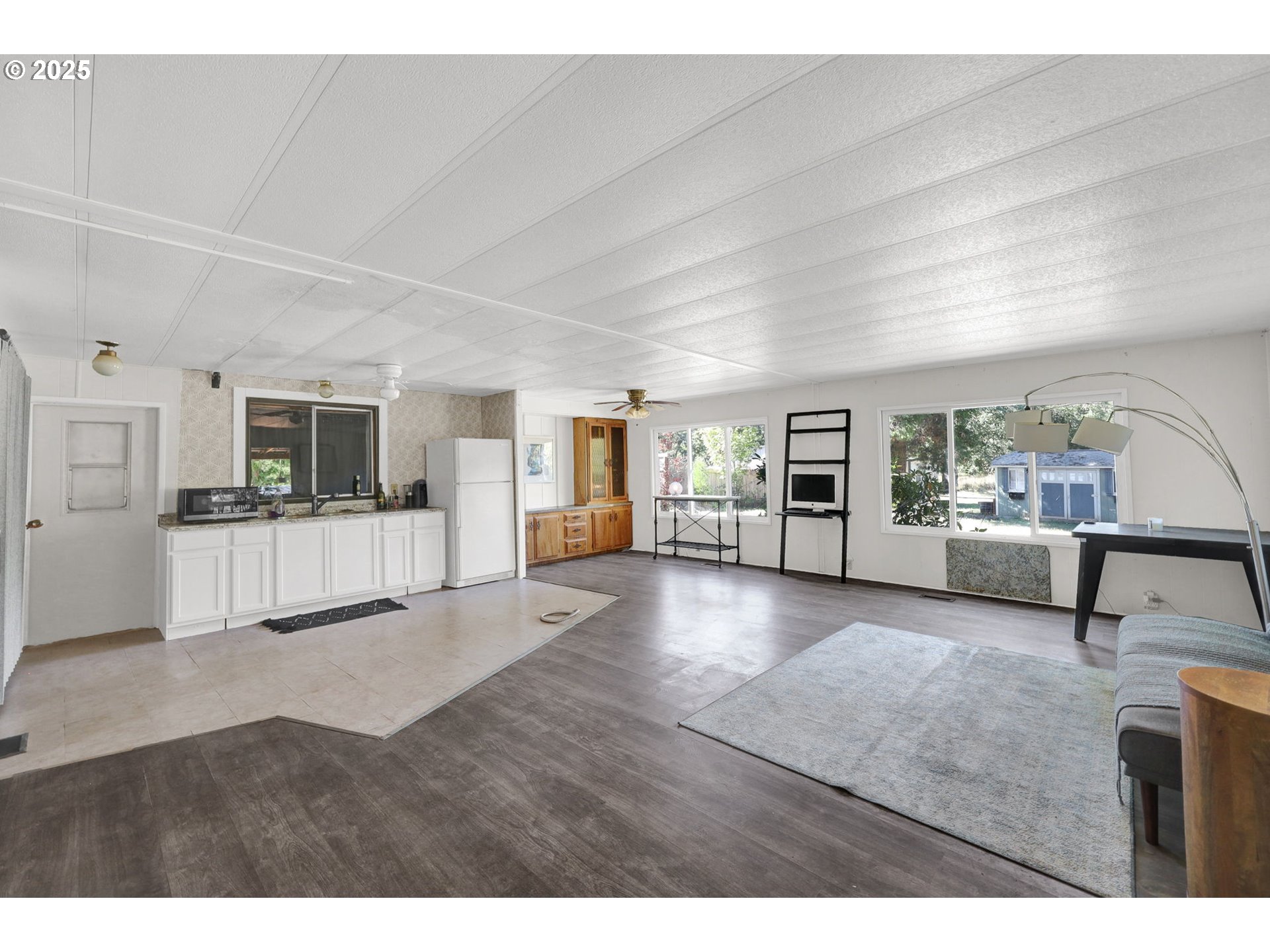 31145 Kenady Lane Cottage Grove, OR 97424 - Photo 8 of 47 a view of living room kitchen with furniture and flat screen tv