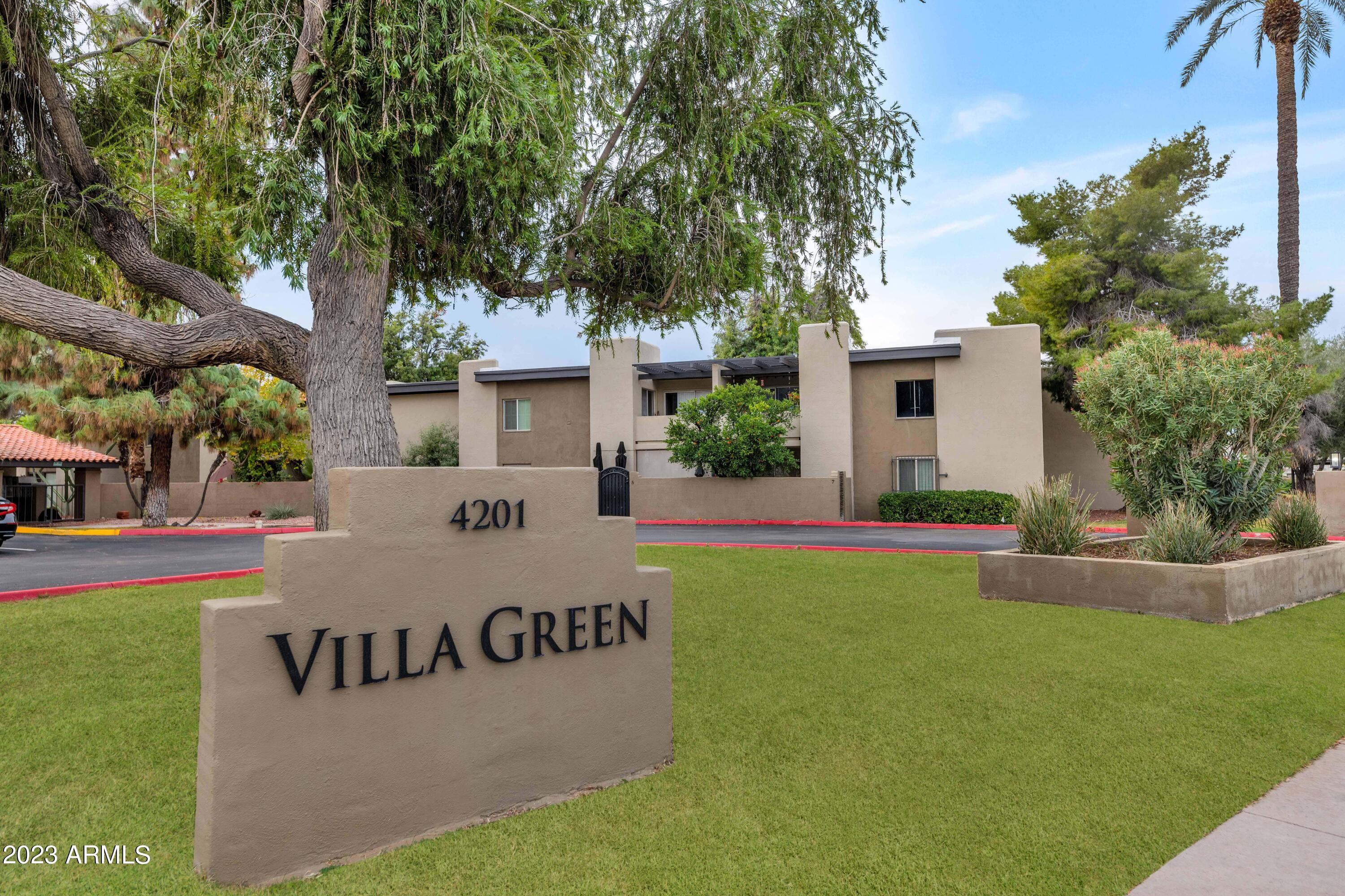 4201 East Camelback Road, Unit 90 Phoenix, AZ 85018 - Photo 1 of 30 a view of a house with a yard