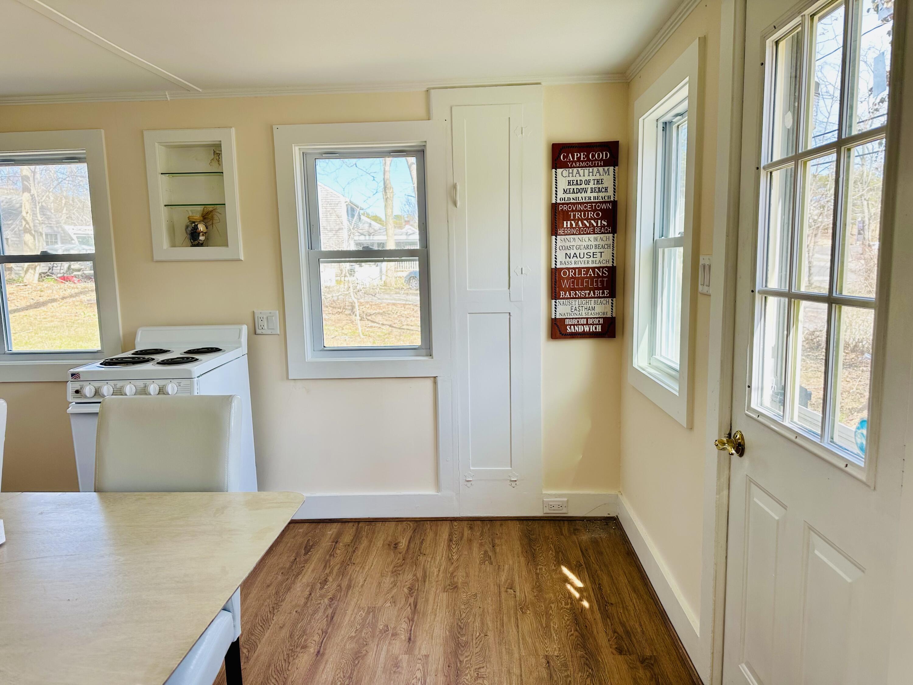 36 Cove Road Wellfleet, MA 02667 - Photo 11 of 22 a view of a kitchen with furniture and windows