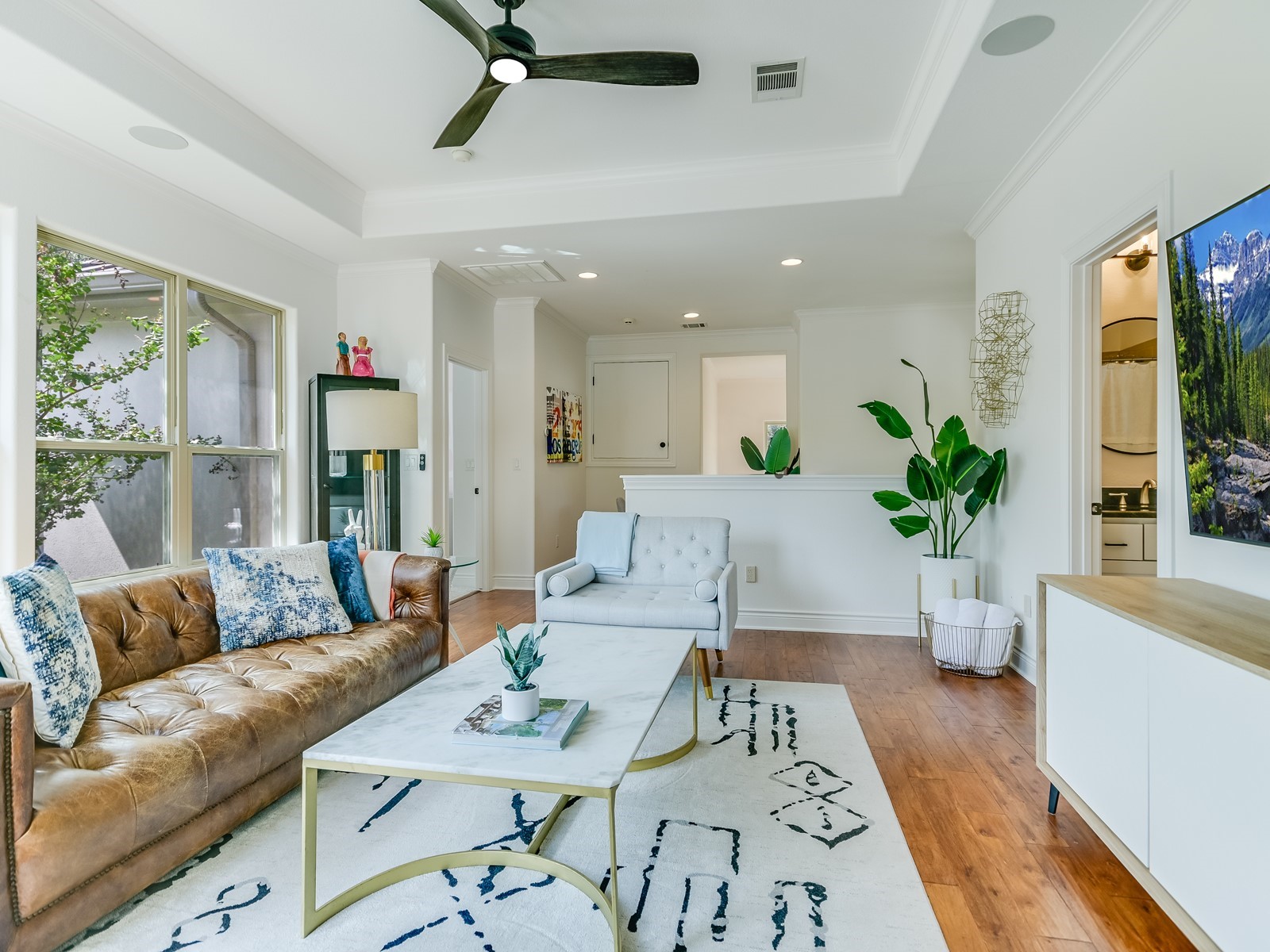 809 Kinney Avenue Austin, TX 78704 - Photo 12 of 21 a living room with furniture and a potted plant