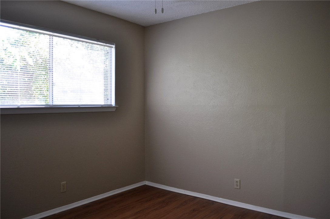 2616 Berkeley Avenue, Unit A Austin, TX 78745 - Photo 2 of 11 a view of a small space with wooden floor and a window