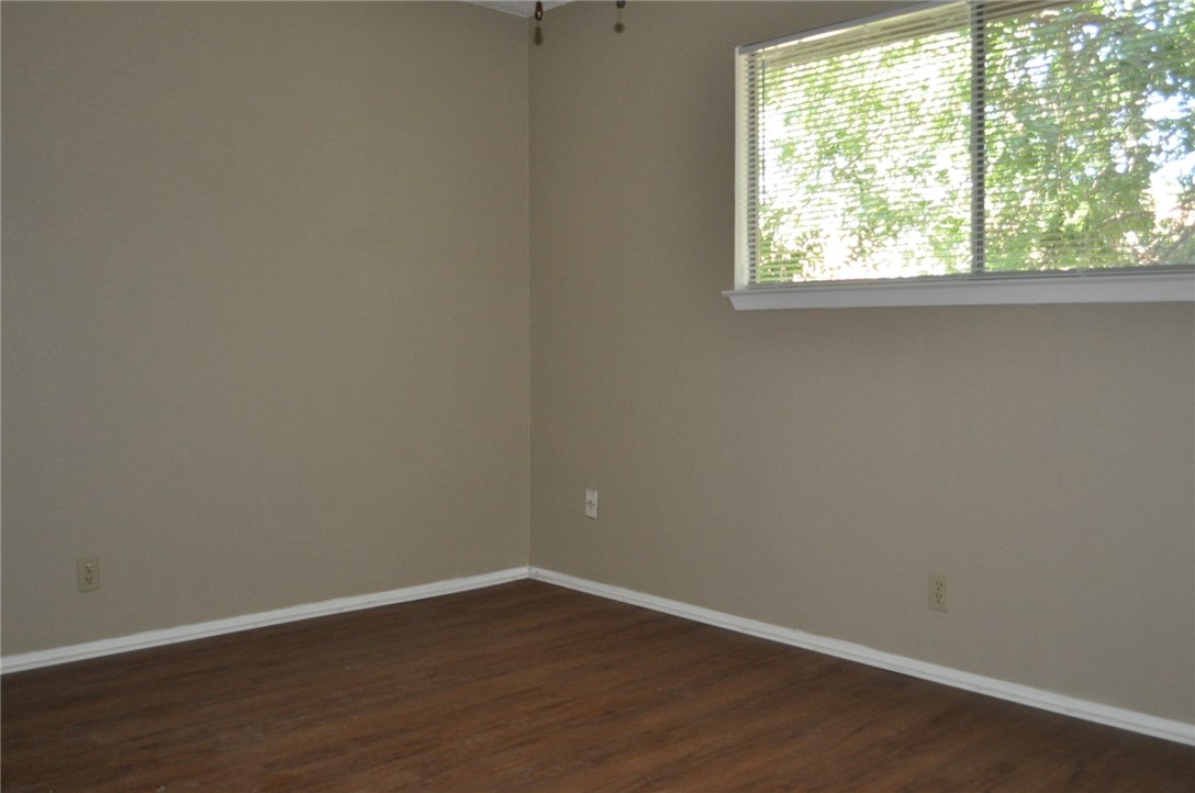 2616 Berkeley Avenue, Unit A Austin, TX 78745 - Photo 3 of 11 a view of a small space with wooden floor and a window
