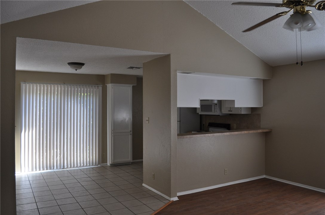 2616 Berkeley Avenue, Unit A Austin, TX 78745 - Photo 7 of 11 a kitchen with stainless steel appliances a refrigerator and a stove top oven
