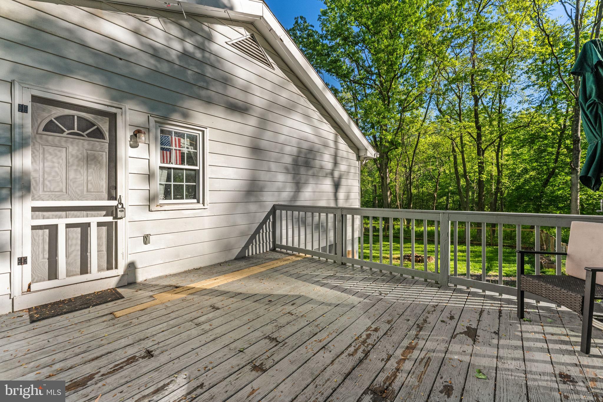 673 Creek Road Front Royal, VA 22630 - Photo 52 of 64 Sunny deck with serene woodland views.