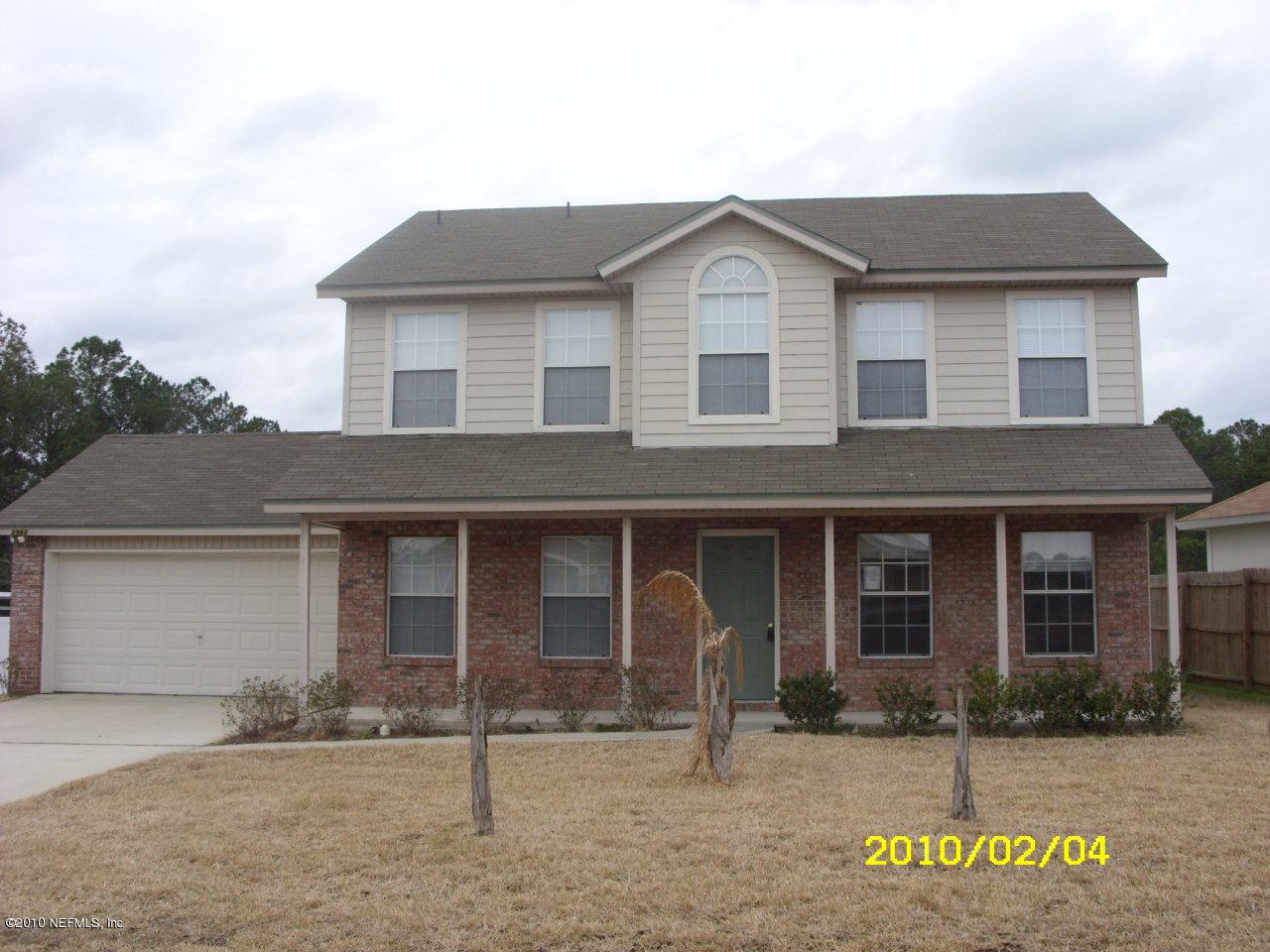 2962 Ravine Hill Drive Middleburg, FL 32068 - Photo 1 of 7 a front view of a house with garden