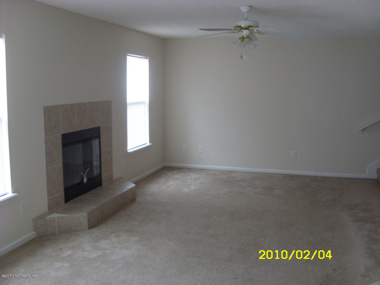 2962 Ravine Hill Drive Middleburg, FL 32068 - Photo 5 of 7 an empty room with windows and fireplace