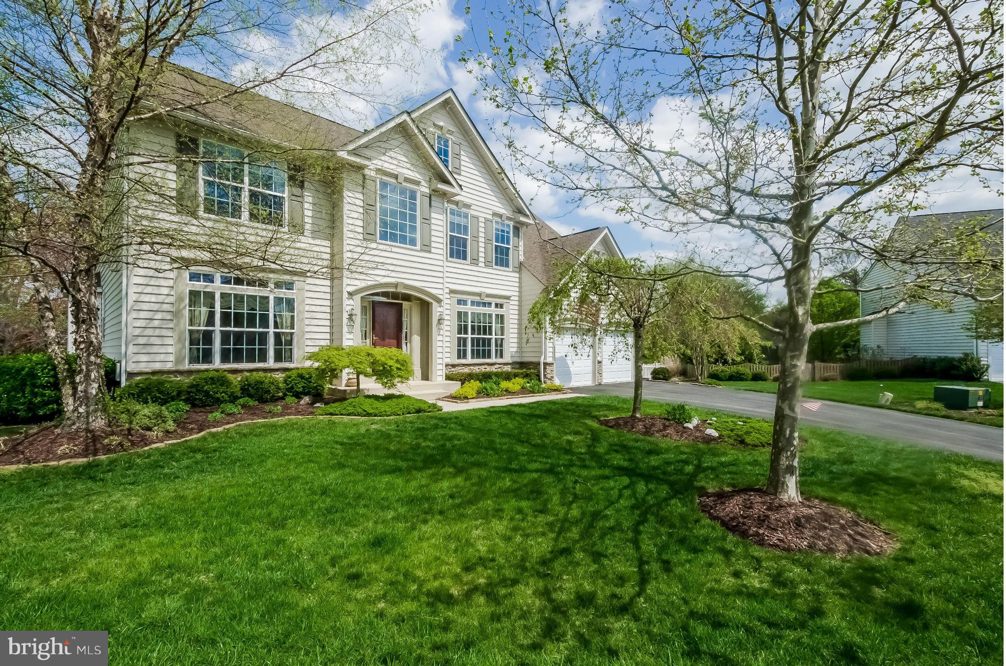 615 Sand Road Severn, MD 21144 - Photo 1 of 30 a front view of a house with garden and porch
