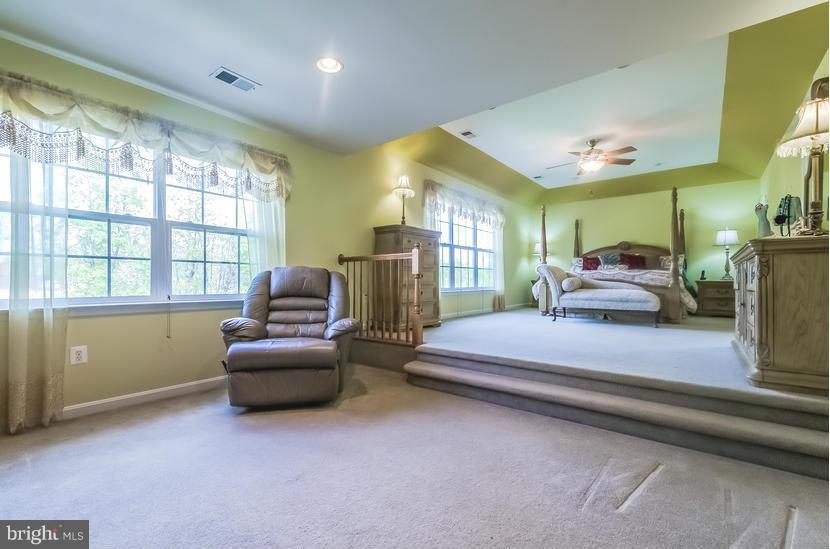 615 Sand Road Severn, MD 21144 - Photo 16 of 30 a bedroom with furniture and a large window