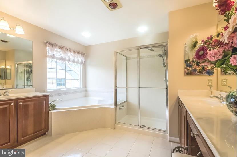 615 Sand Road Severn, MD 21144 - Photo 18 of 30 a bathroom with a tub sink and mirror