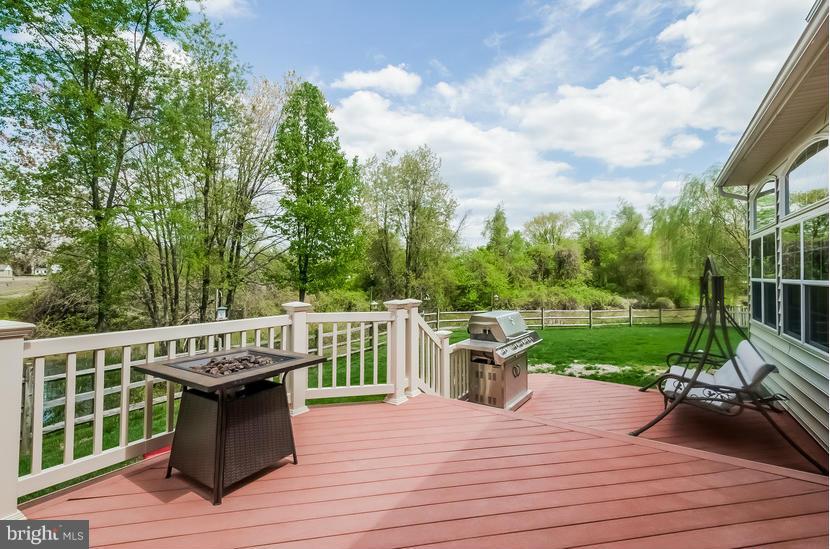 615 Sand Road Severn, MD 21144 - Photo 20 of 30 a view of a deck with wooden floor and outdoor seating