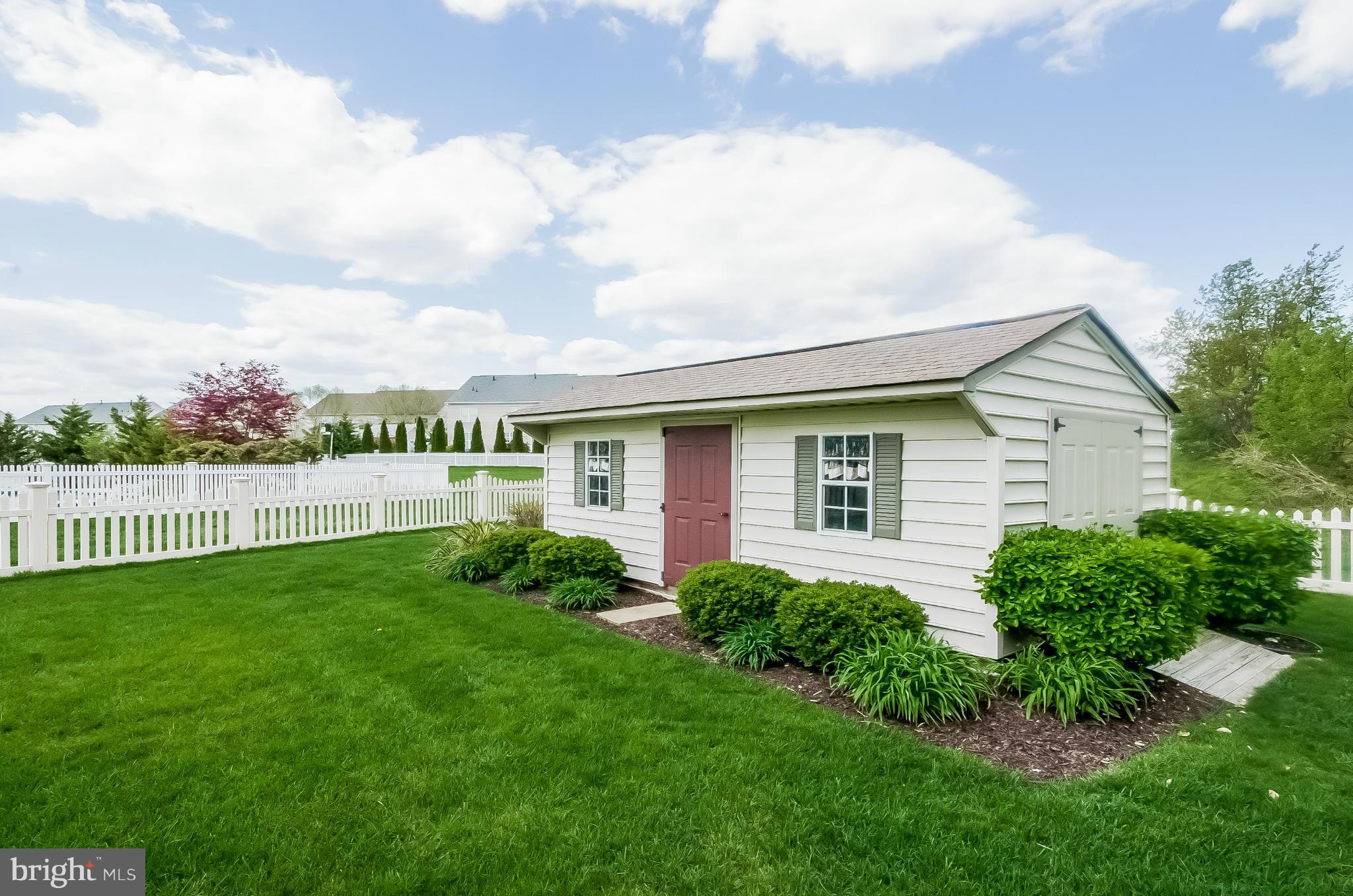 615 Sand Road Severn, MD 21144 - Photo 29 of 30 a view of a house with a yard and fence