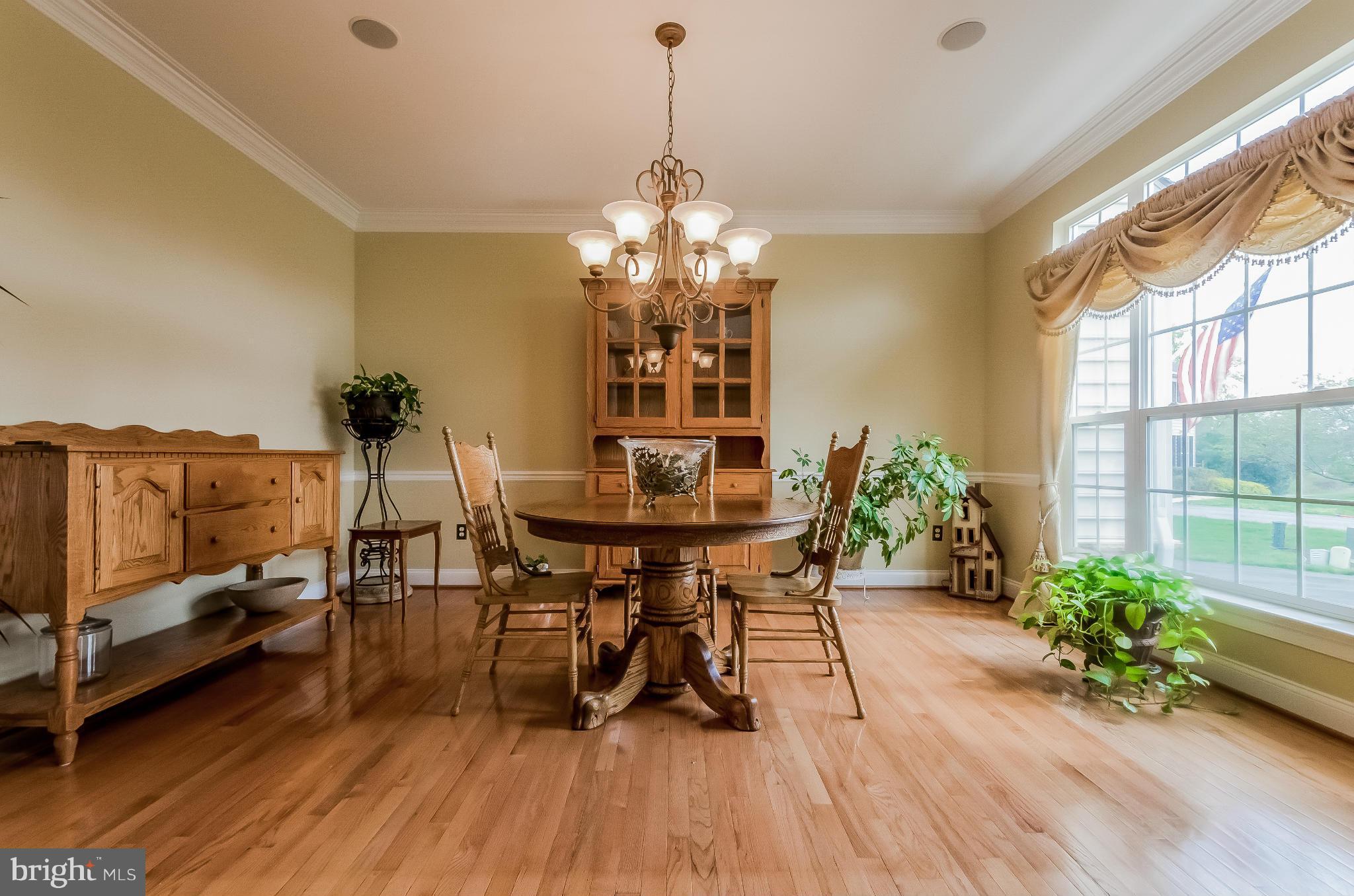 615 Sand Road Severn, MD 21144 - Photo 6 of 30 a view of a dining room with furniture window and wooden floor