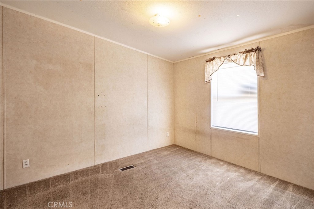 36249 Campbell Road Lucerne Valley, CA 92356 - Photo 23 of 32 a view of an empty room with a window