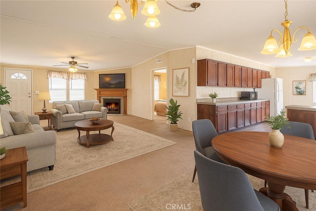 36249 Campbell Road Lucerne Valley, CA 92356 - Photo 3 of 32 a living room with furniture a dining table and a chandelier
