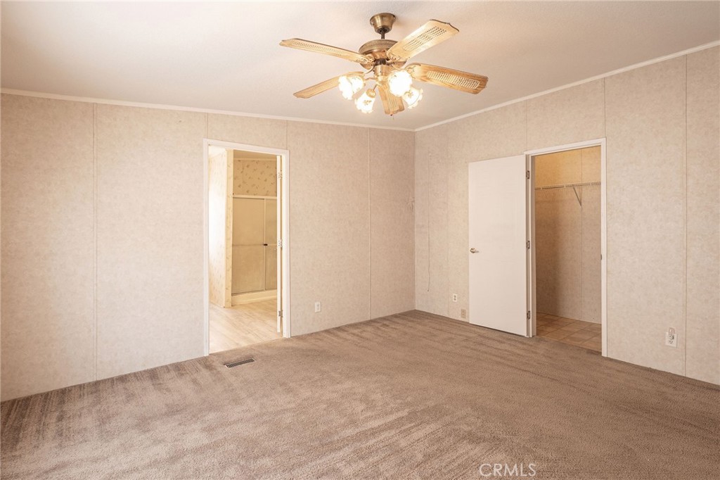36249 Campbell Road Lucerne Valley, CA 92356 - Photo 8 of 32 an empty room with windows and fan