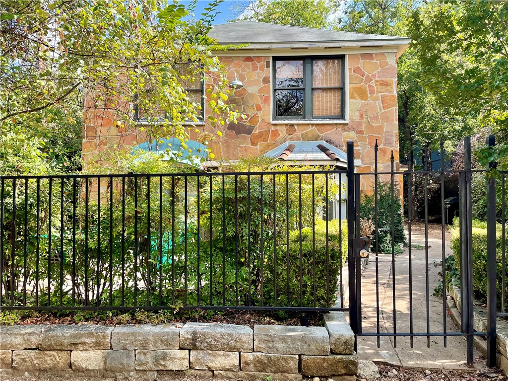 a view of a brick house with a large windows