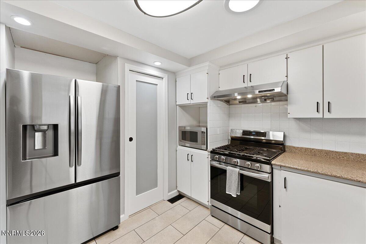 2205 Carlin Street Reno, NV 89503 - Photo 15 of 51 a kitchen with stainless steel appliances a refrigerator stove and sink