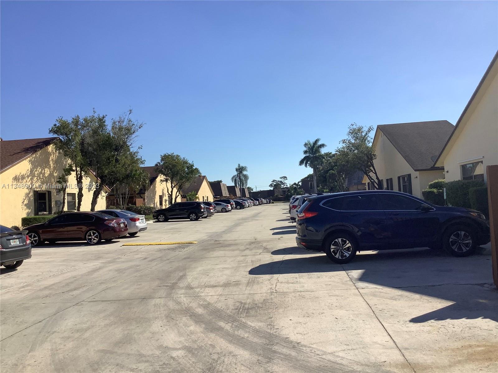 464 Springdale Circle, Unit 46D Palm Springs, FL 33461 - Photo 16 of 21 a car parked on the side of a street