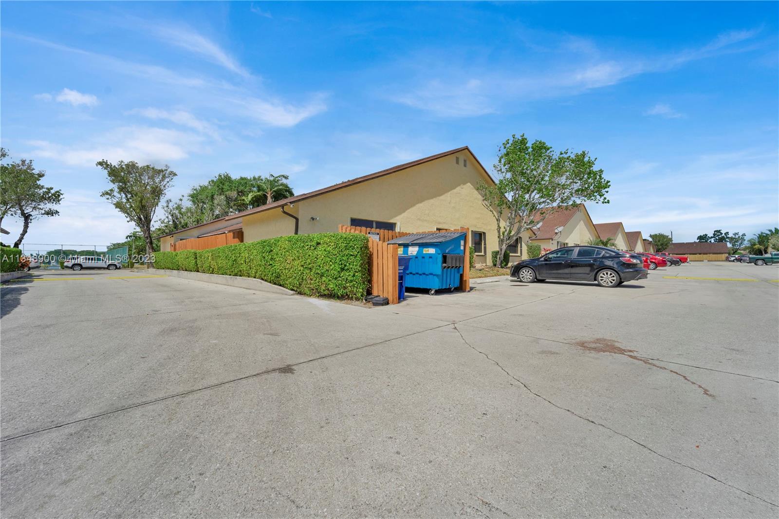464 Springdale Circle, Unit 46D Palm Springs, FL 33461 - Photo 19 of 21 a car parked on the side of the road
